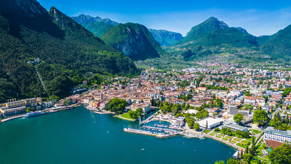 Aerial view of Riva del Garda with Torre Apponale, MAG museum, bike paths, boats and river ferries...
