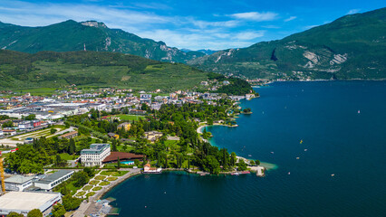 Aerial view of Riva del Garda with Torre Apponale, MAG museum, bike paths, boats and river ferries...