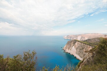 Stunning cliffs rise dramatically from vibrant blue waters, inviting summer adventurers to explore Zakynthos' natural beauty