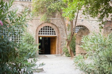 Relaxation takes center stage in Zakynthos as sun-drenched courtyards invite visitors to unwind amidst lush greenery and historical architecture. A peaceful summer escape awaits
