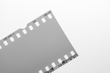 Blank monochrome 35mm Film Strip with Frame Number 13 and Code on White Background