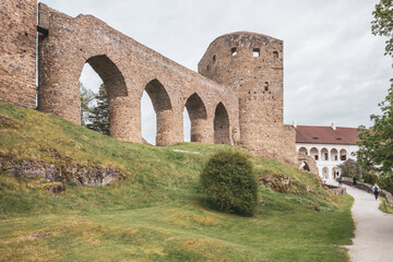 Fototapeta premium Venture to Velhartice Castle in Czechia to admire the impressive Gothic bridge and its historic architecture, surrounded by lush greenery and scenic pathways inviting exploration.