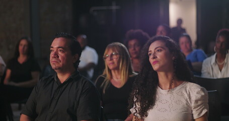 Fototapeta premium Focused audience attentively listening to a spiritual speaker, diverse group of people engaged in faith-based message, community connection, and shared inspiration