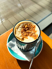 Nice Texture of Latte art on hot latte coffee . Milk foam with sweet topping. Latte art from professional barista artist. Vertical.