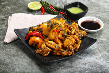 Vietnamese cuisine - fried frog with vegetables