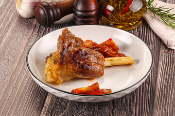 Baked lamb shank with vegetables