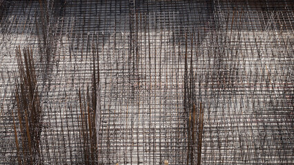 Industrial background. Foundation construction. Tied metal reinforcement before pouring concrete