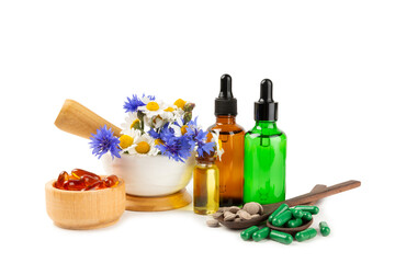 Alternative medicine herbal capsule organic drug isolated on white background.Assortment of herbal...