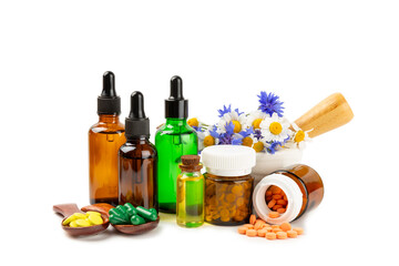 Alternative medicine herbal capsule organic drug isolated on white background.Assortment of herbal...