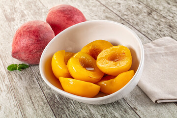 Sweet ripe yellow canned peaches