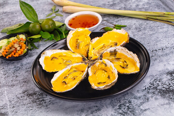 Baked oyster with cheddar cheese
