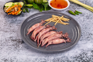 Boiled wild mini calamari snack