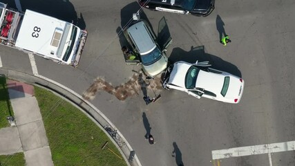 Car accident on city street in Florida. Result of distracted driving and speeding. Emergency services at vehicle crash in USA.