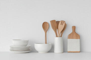 collection of modern kitchen utensils on clean white background featuring soft shadows