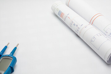 Electrical diagrams with voltage tester on white background
