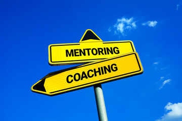 Mentoring vs Coaching - Traffic sign with two options - difference and comparison between methods...