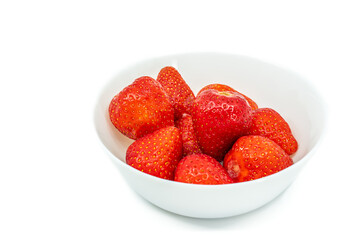 Strawberries in white bowl isolated on white
