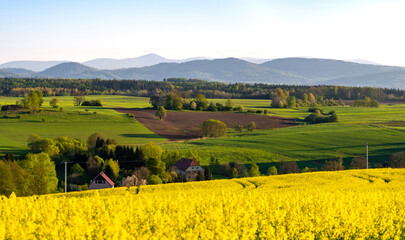 view on Kaczawskie mountains during spring evening in Lower Silesia region in Poland