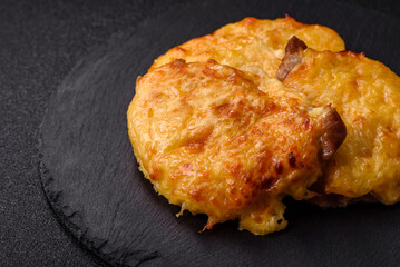 Steak, a pork or chicken chop covered with melted cheese. Grilled meat