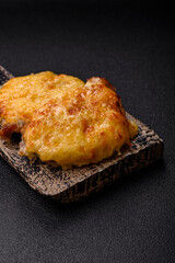 Steak, a pork or chicken chop covered with melted cheese. Grilled meat