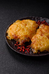 Steak, a pork or chicken chop covered with melted cheese. Grilled meat