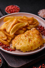 Fried French fries with a piece of meat, lunch food. Prepared potatoes and meat