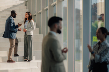 Business people talking and having informal conversations in modern office building