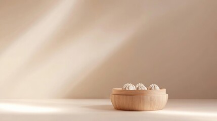 Minimalist background with centered bamboo steamer containing beautifully arranged dumplings
