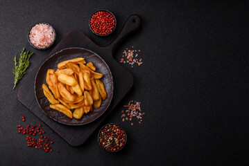 Fried crispy French fries with salt, spices, food for lunch