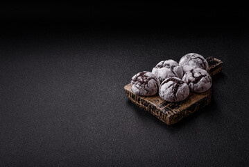 Chocolate crinkle cookies sprinkled with powdered sugar, homemade baking