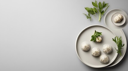 Minimalist modern presentation of dim sum on matte ceramic plates with clean background