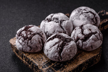 Chocolate crinkle cookies sprinkled with powdered sugar, homemade baking