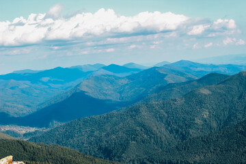 Fototapeta premium Scenic view of Carpathians mountain ranges with lush forests and cloud formations