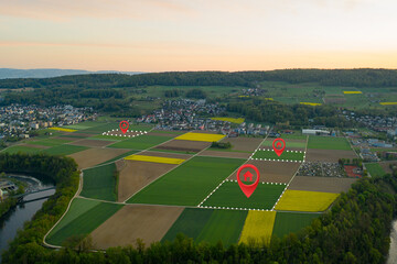 Land plot management - real estate concept with a vacant land on a green field available for building construction and housing subdivision in a residential area for sale, rent, buy or investment.