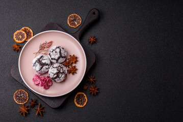 Chocolate crinkle cookies sprinkled with powdered sugar, homemade baking