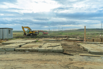 Dynamic Construction Site: Heavy Machinery in Action Under a Dramatic Sky. Innovative...