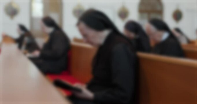 nuns singing prayers in church