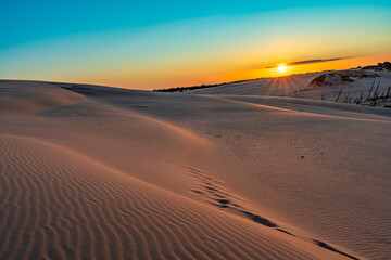 Sunset Over Serene Desert Dunes