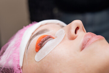 The process of professional lamination and tinting of eyelashes in the salon.