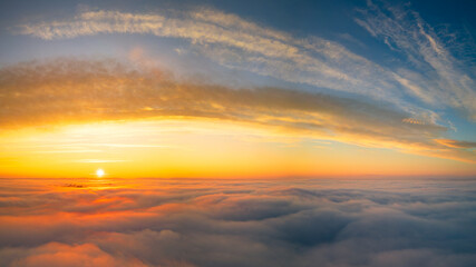 panoramic photo of morning inversion with rising sun