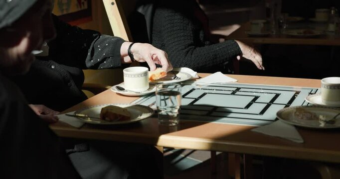 retired nuns having coffe break at retirement home