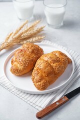 Sesame seeds braided bun on a white background