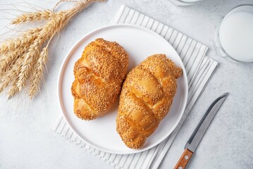 Sesame seeds braided bun on a white background