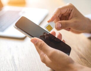 Hands inserting SIM card into phone (1)