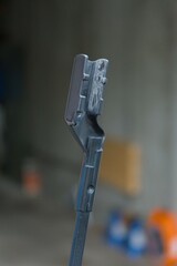 A close-up reveals a sleek, dark grey mechanical component, highlighting its intricate design and robust construction. Perfect for technical applications.