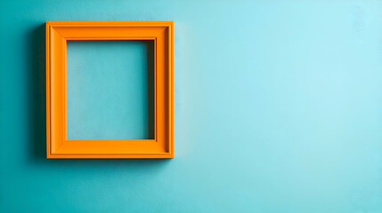 Fototapeta premium Orange Picture Frame Against Teal Background
