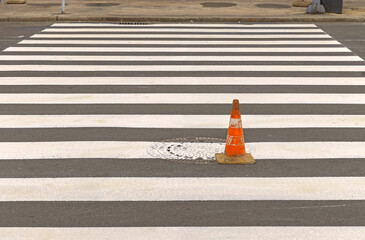 New White Paint Lines Pedestrian Street Crossing With One Traffic Cone