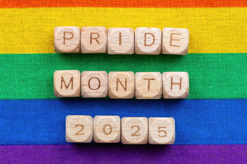 Pride month 2025 celebration on vibrant rainbow background