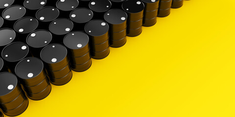 Top view on rows of black metal oil barrels on yellow background with place for text on right. Oil industry concept. 3d render illustration