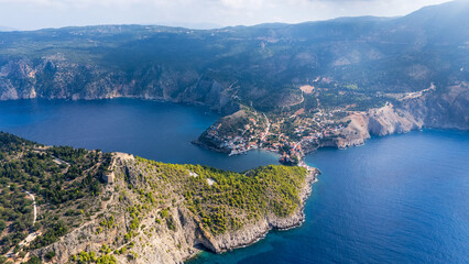 Fototapeta premium Stunning aerial view of a picturesque coastal village Assos of Keflaonia surrounded by mountains and clear blue waters